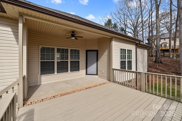 wooden deck with a ceiling fan