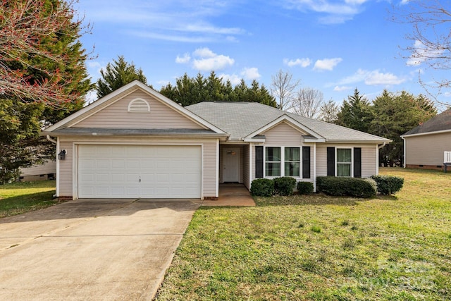 ranch-style house featuring an attached garage, concrete driveway, and a front yard