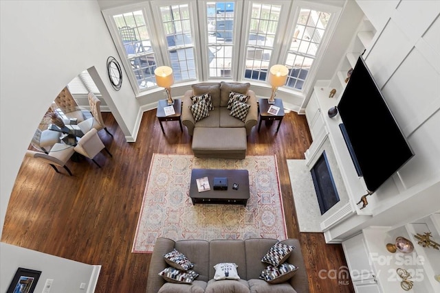 living room featuring baseboards and wood finished floors