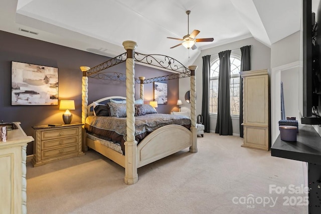 bedroom with light carpet, visible vents, ceiling fan, and vaulted ceiling