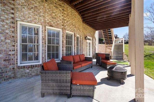 view of patio featuring an outdoor hangout area and stairs