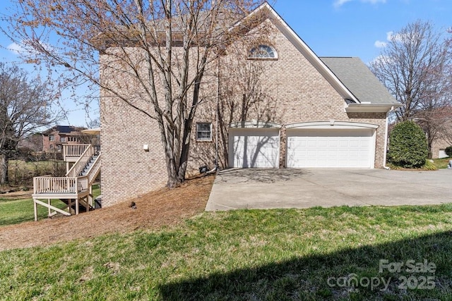 view of front of home with brick siding, an attached garage, stairs, roof with shingles, and driveway