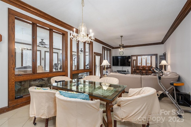 tiled dining room with crown molding and ceiling fan with notable chandelier