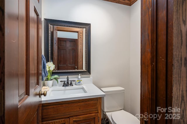 bathroom with toilet and vanity