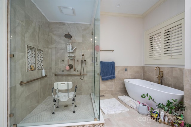 full bath with crown molding, tile walls, a stall shower, and a freestanding bath