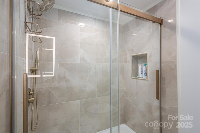 full bathroom featuring a stall shower and ornamental molding