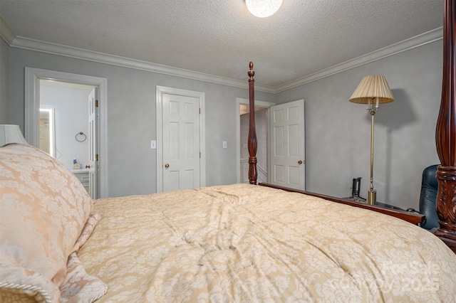 bedroom featuring a textured ceiling and ornamental molding