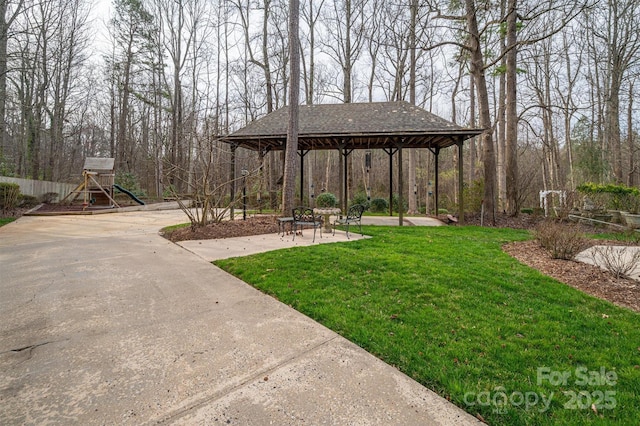 view of yard with a gazebo and playground community