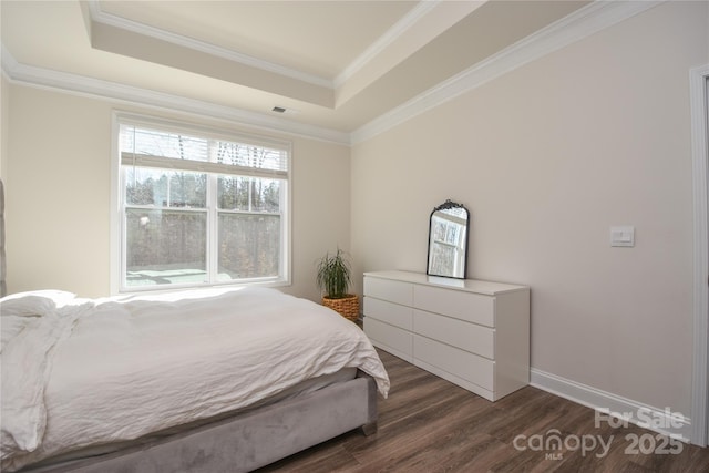 bedroom featuring visible vents, baseboards, a raised ceiling, dark wood-type flooring, and crown molding