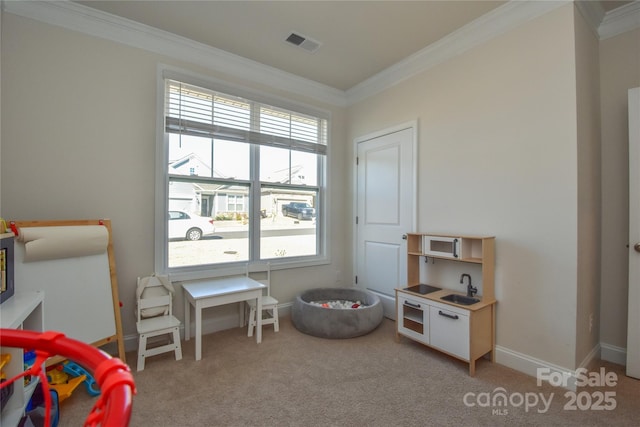 rec room with light carpet, baseboards, visible vents, and ornamental molding