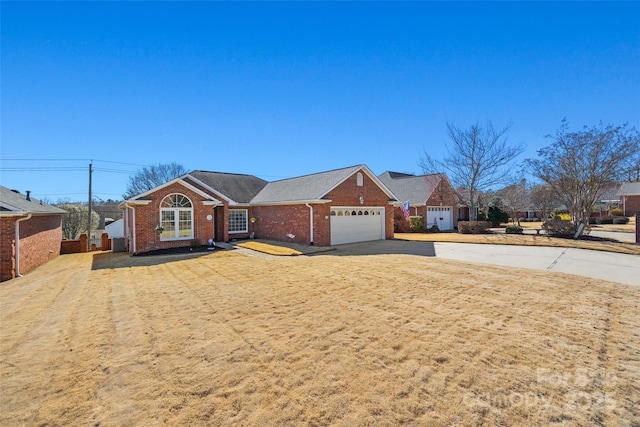 single story home featuring brick siding, driveway, and an attached garage