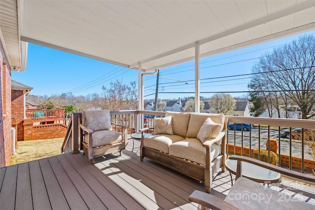 wooden deck with an outdoor hangout area