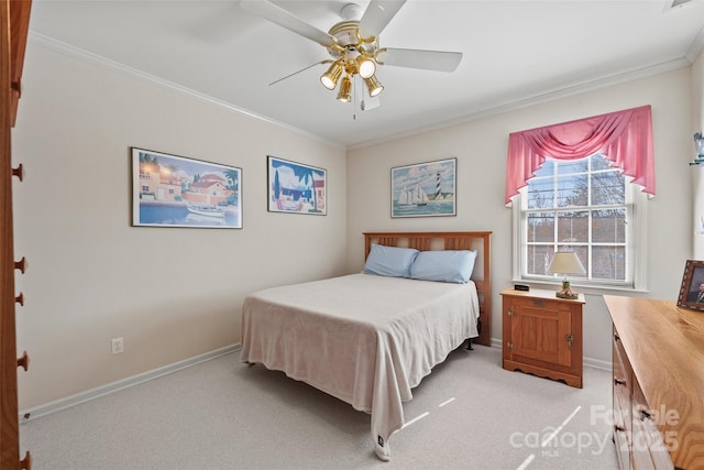 bedroom with light carpet, a ceiling fan, baseboards, and ornamental molding