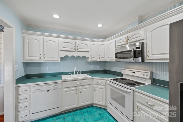 kitchen featuring a sink, white appliances, and white cabinets