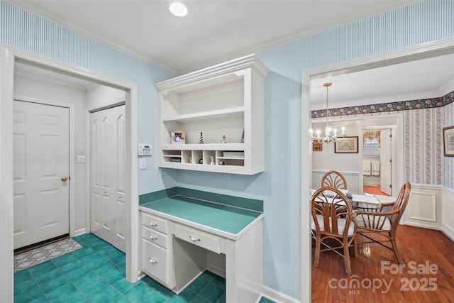 office area with wood finished floors, a wainscoted wall, wallpapered walls, an inviting chandelier, and crown molding