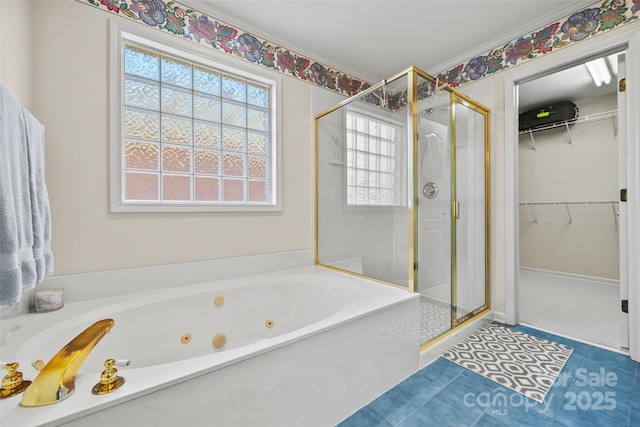 full bath with a shower stall, a spacious closet, and a whirlpool tub