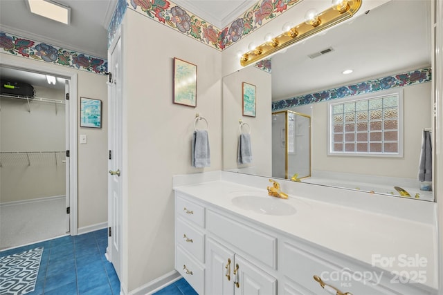 bathroom featuring tile patterned floors, visible vents, a walk in closet, a shower stall, and vanity