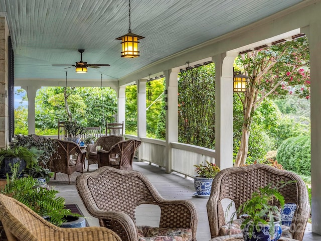 sunroom with a ceiling fan