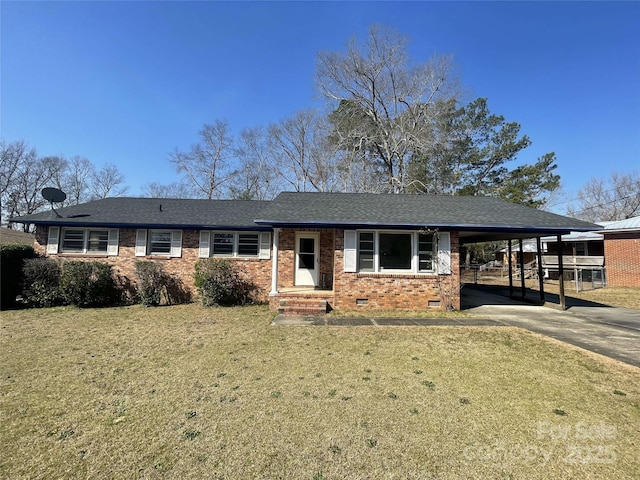 single story home featuring brick siding, a front yard, crawl space, an attached carport, and driveway