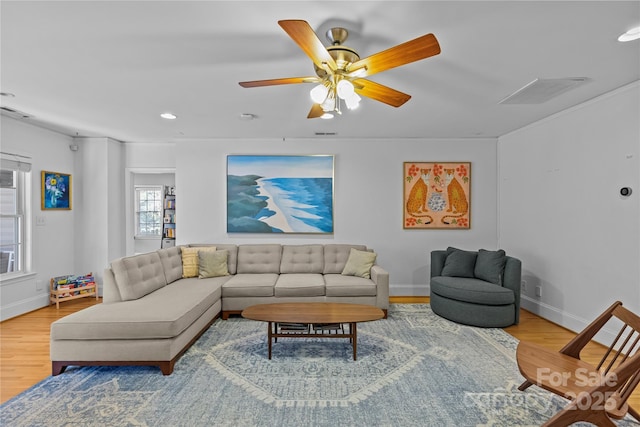 living area featuring ceiling fan, recessed lighting, wood finished floors, visible vents, and baseboards