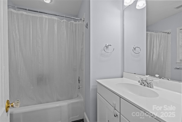 bathroom with shower / bathtub combination with curtain and vanity