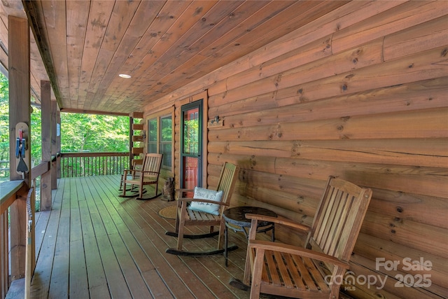 wooden terrace with a porch