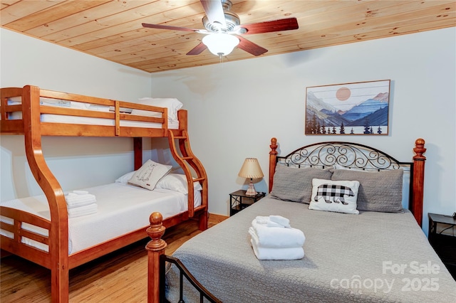 bedroom featuring wooden ceiling, a ceiling fan, and wood finished floors