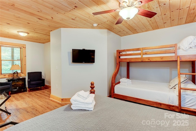 bedroom featuring wooden ceiling, wood finished floors, a ceiling fan, and baseboards