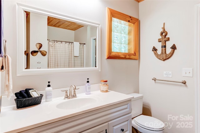 full bathroom featuring toilet and vanity