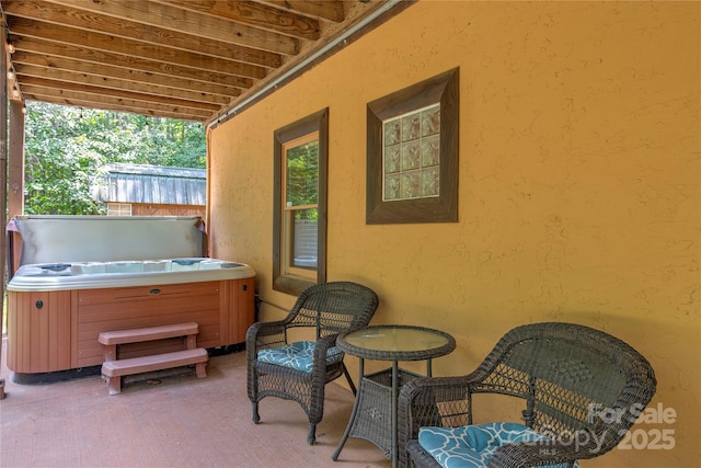 view of patio with a hot tub