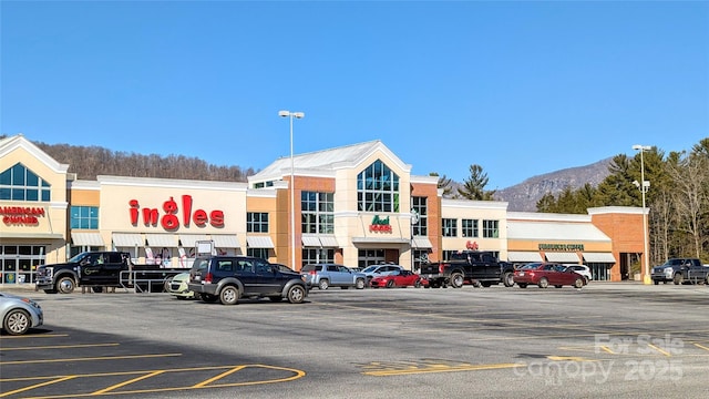 view of building exterior featuring uncovered parking