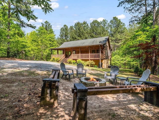 145 Jobes Trl, Mill Spring, NC 28756 - surrounding community with a forest view, stairs, and an outdoor fire pit