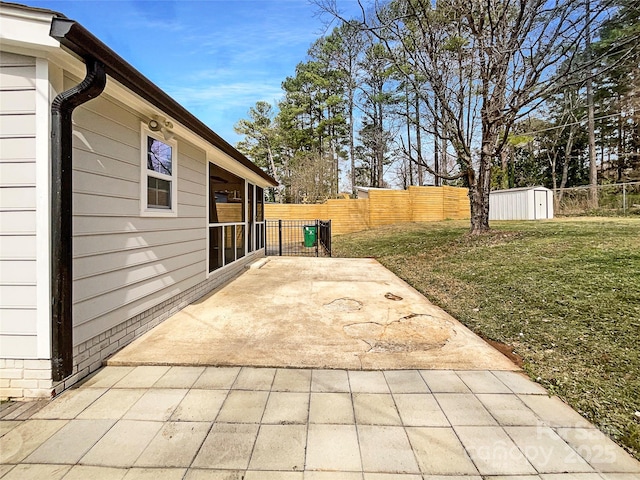 view of patio / terrace featuring a fenced backyard, a shed, and an outdoor structure