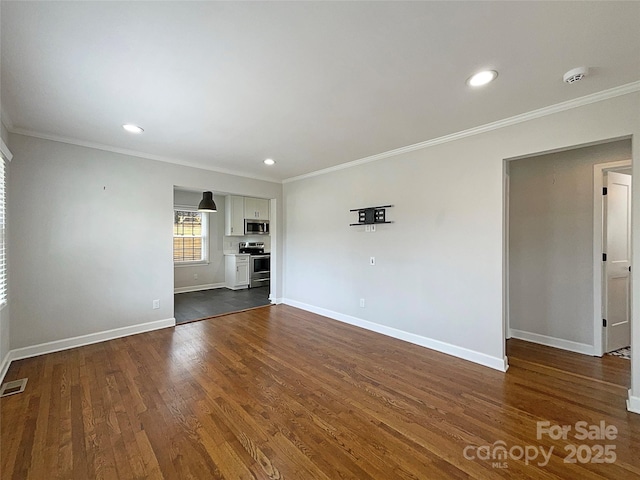 unfurnished living room with baseboards, dark wood finished floors, and crown molding