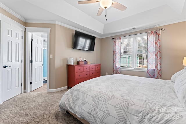 bedroom featuring baseboards, a tray ceiling, ornamental molding, and light colored carpet