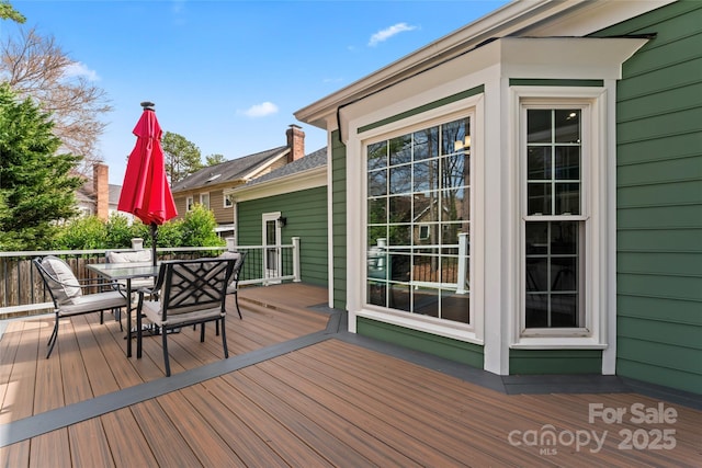 deck featuring outdoor dining area