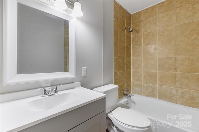 bathroom with vanity, toilet, and tub / shower combination