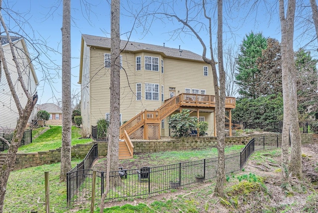 back of house featuring a deck, stairs, and a fenced backyard