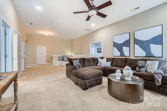 living area featuring a ceiling fan, light colored carpet, visible vents, and baseboards