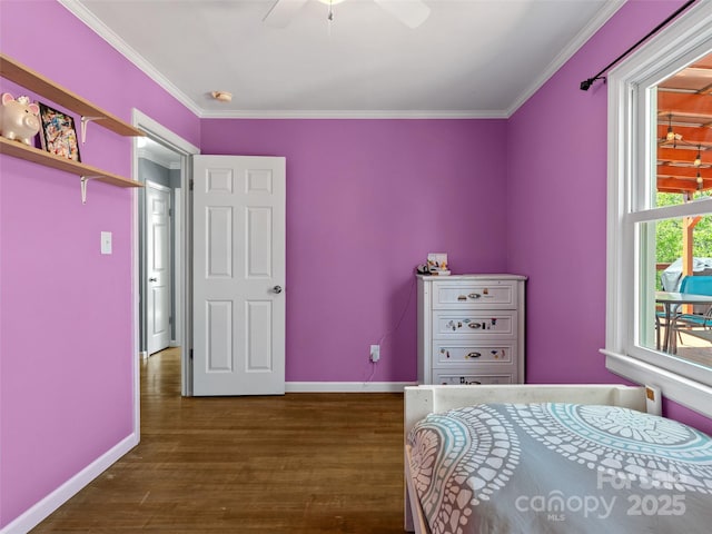 bedroom with dark wood-style floors, baseboards, ornamental molding, and a ceiling fan