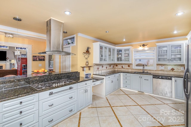 kitchen with a sink, stainless steel appliances, backsplash, and island range hood