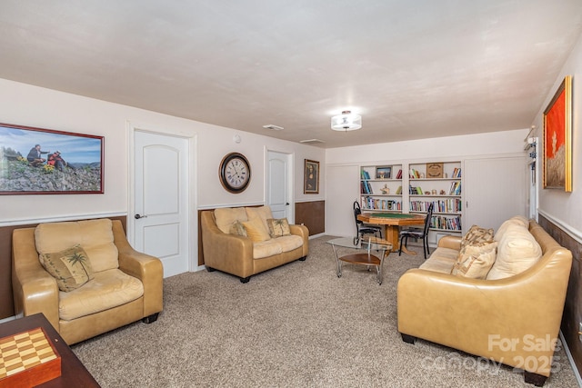 living room with visible vents and carpet flooring