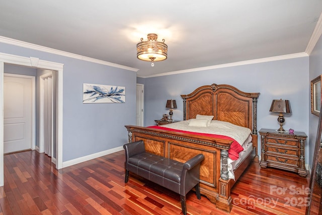 bedroom with crown molding, baseboards, and wood finished floors