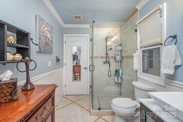 bathroom featuring wainscoting, visible vents, a shower stall, and vanity