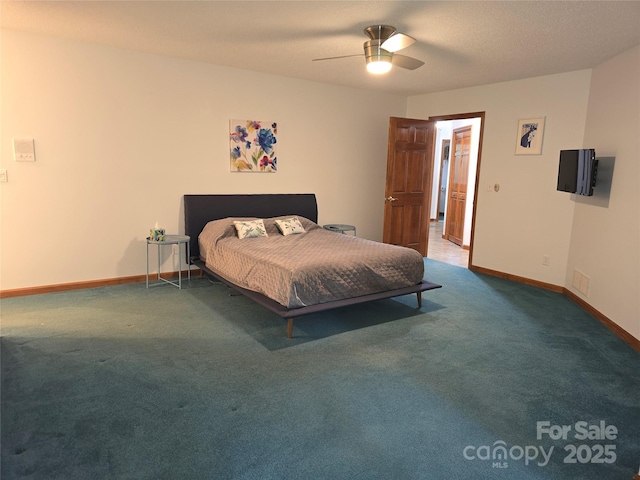 carpeted bedroom featuring visible vents, baseboards, and ceiling fan