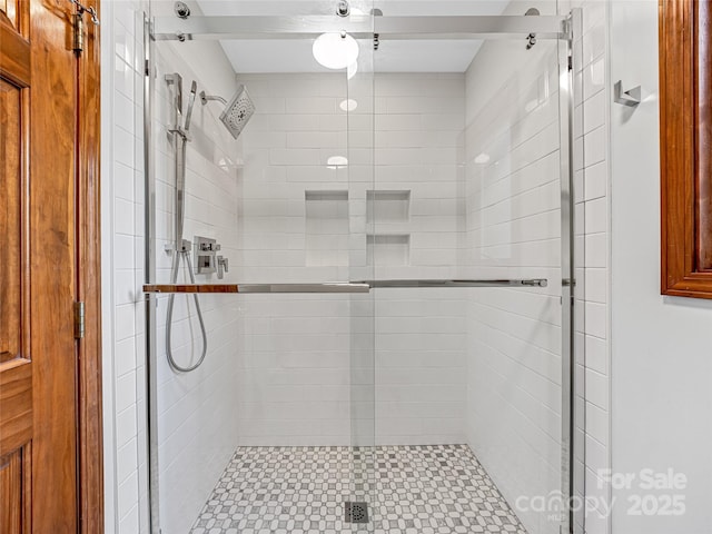 full bath featuring a shower stall