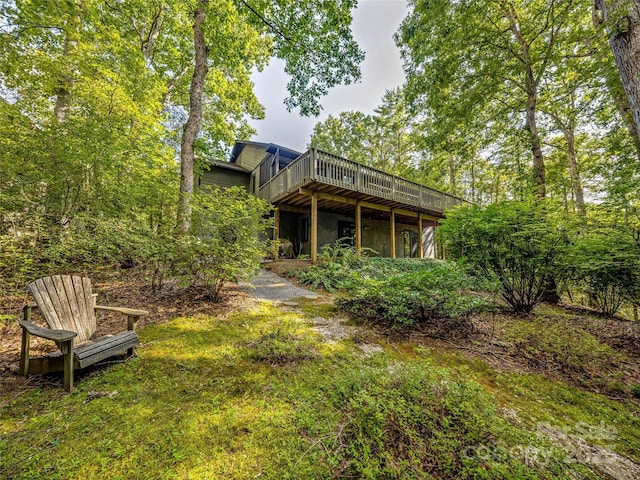 rear view of house featuring a deck