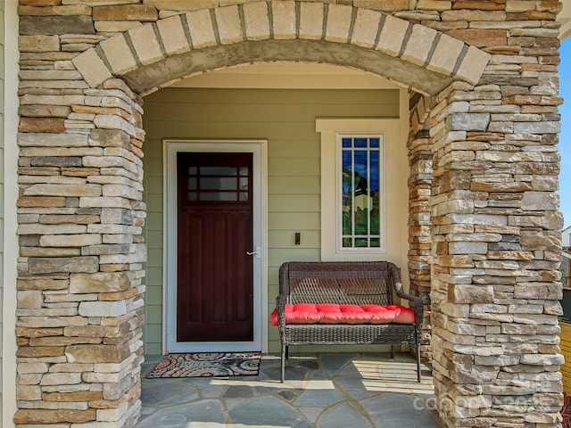 view of exterior entry with stone siding