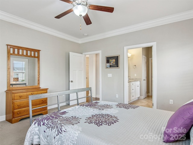 bedroom featuring crown molding, light colored carpet, a ceiling fan, connected bathroom, and baseboards