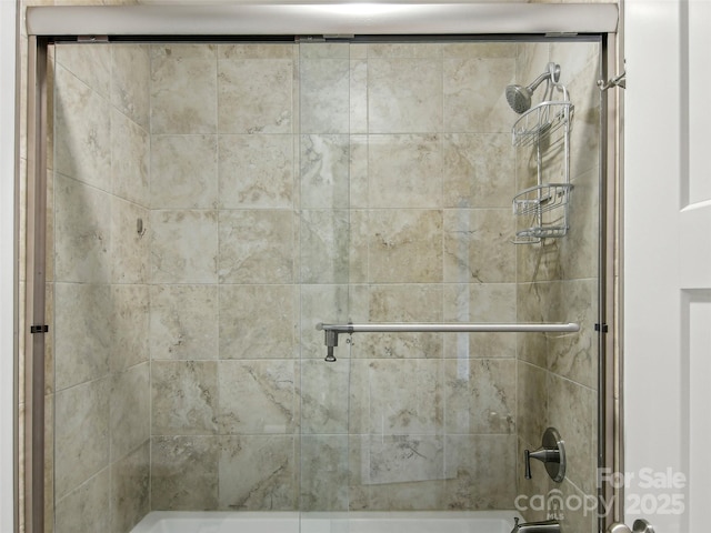 full bathroom with combined bath / shower with glass door